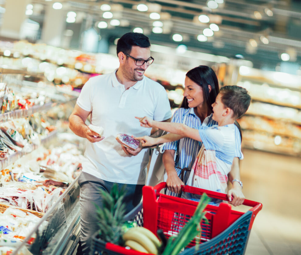 Happy,Family,With,Child,And,Shopping,Cart,Buying,Food,At